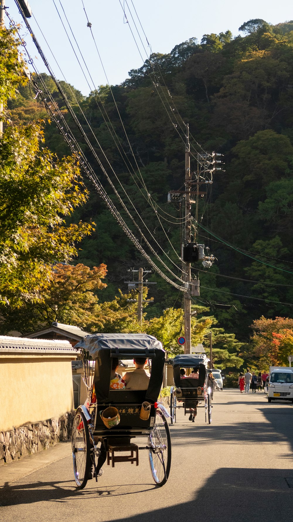 two person riding black carriage