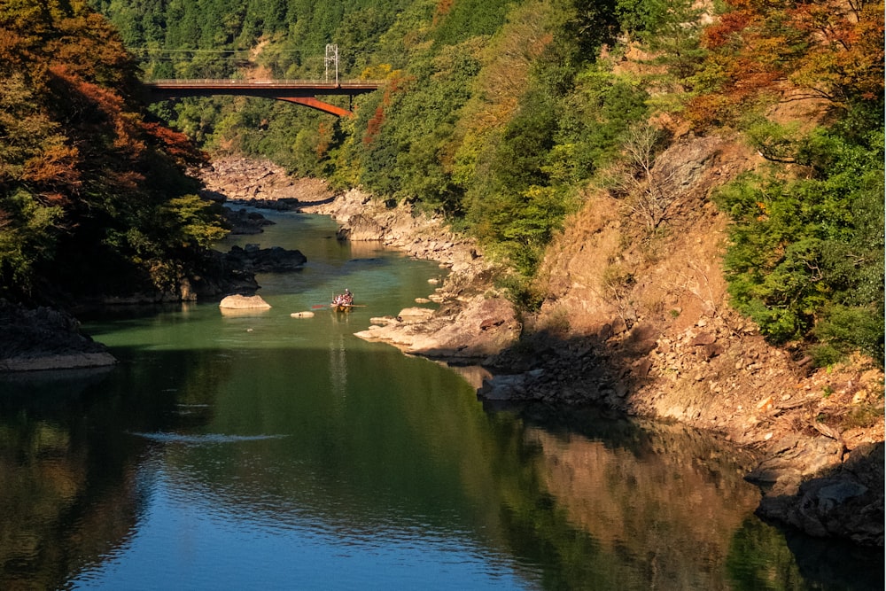 photography of river and mountain range during daytime