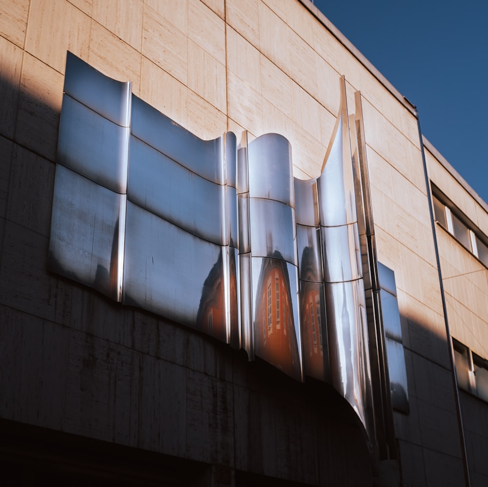 a building with a large metal sculpture on the side of it