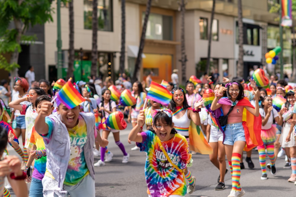 people walking in the street waving flags