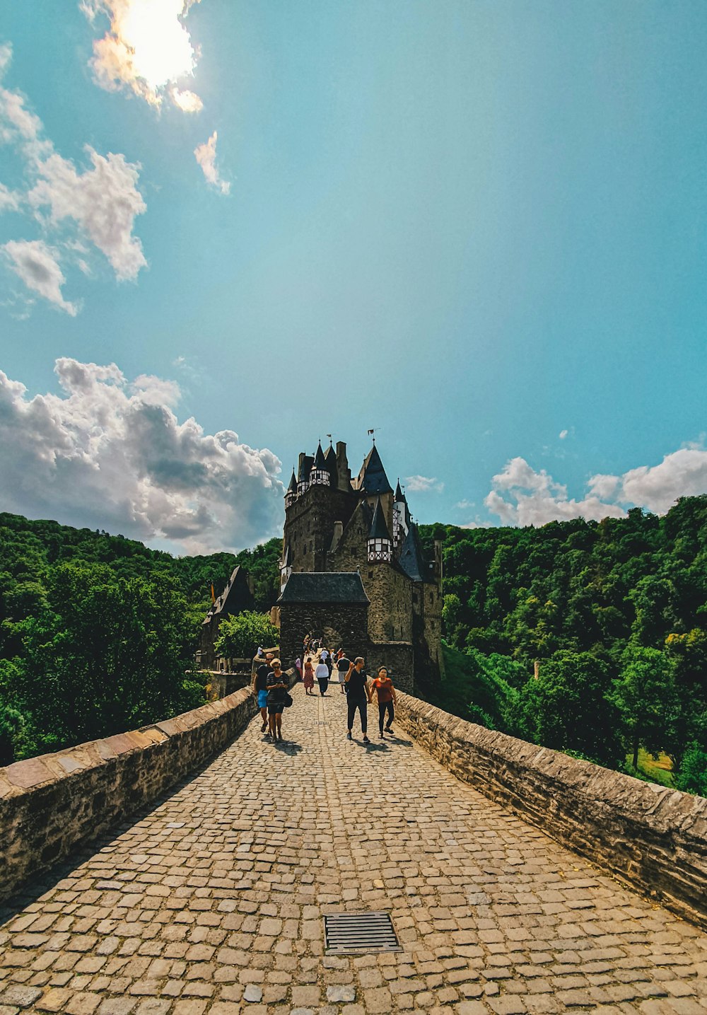 people walking towards castle during daytime