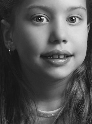 A detailed portrait of a young girl with expressive eyes.