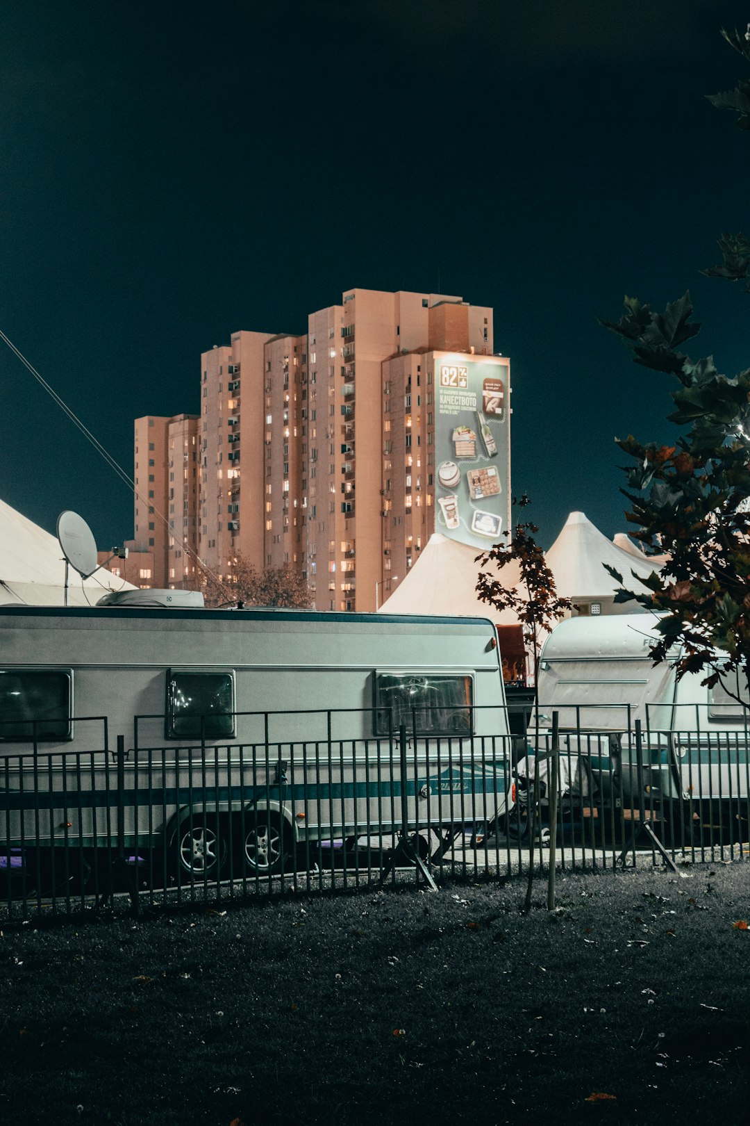 white camper trailer parked on sidewalk