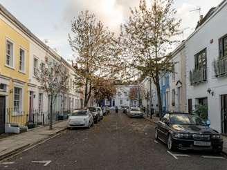 A quiet residential street lined with charming townhouses.