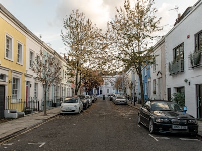 A quiet residential street lined with charming townhouses.