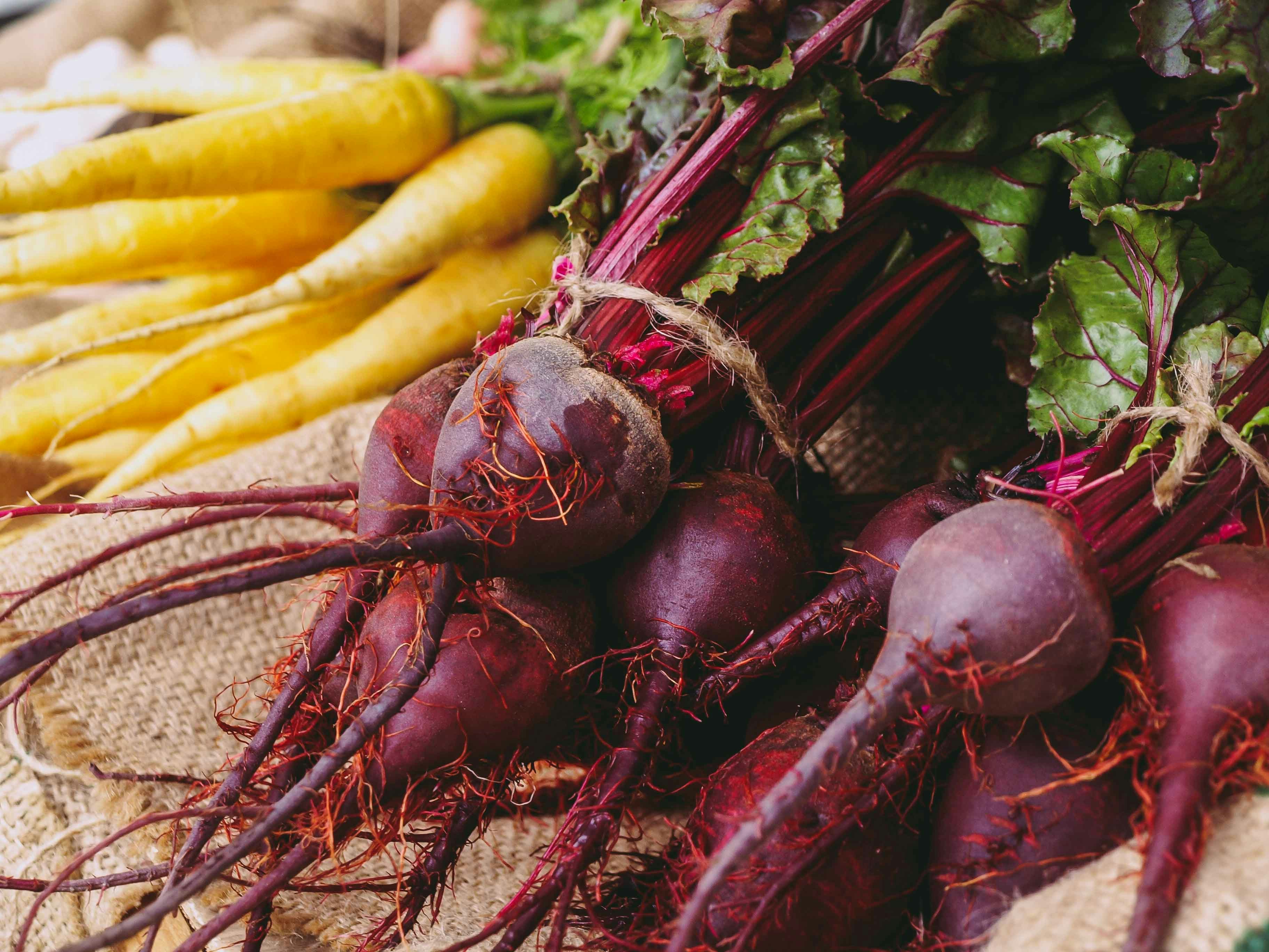 a table topped with beets vegetables
