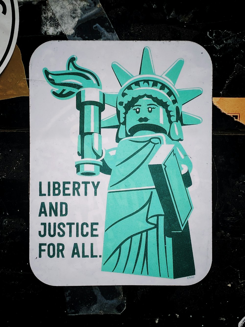 a sticker with a statue of liberty holding a torch