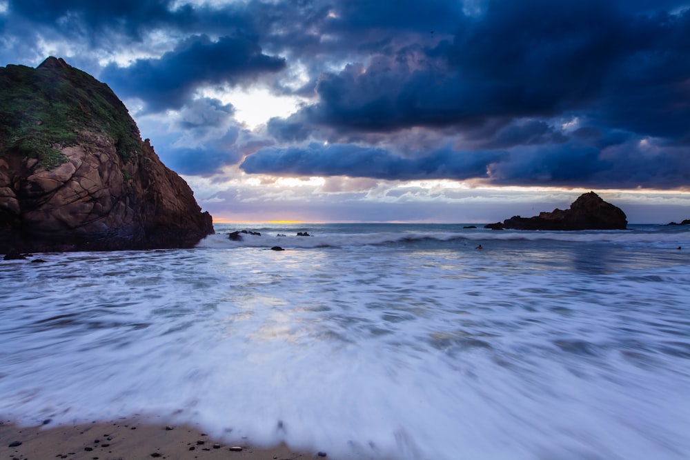 long-exposure photography of sea under cloudy sky