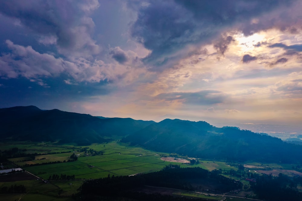 green mountain and field during daytime