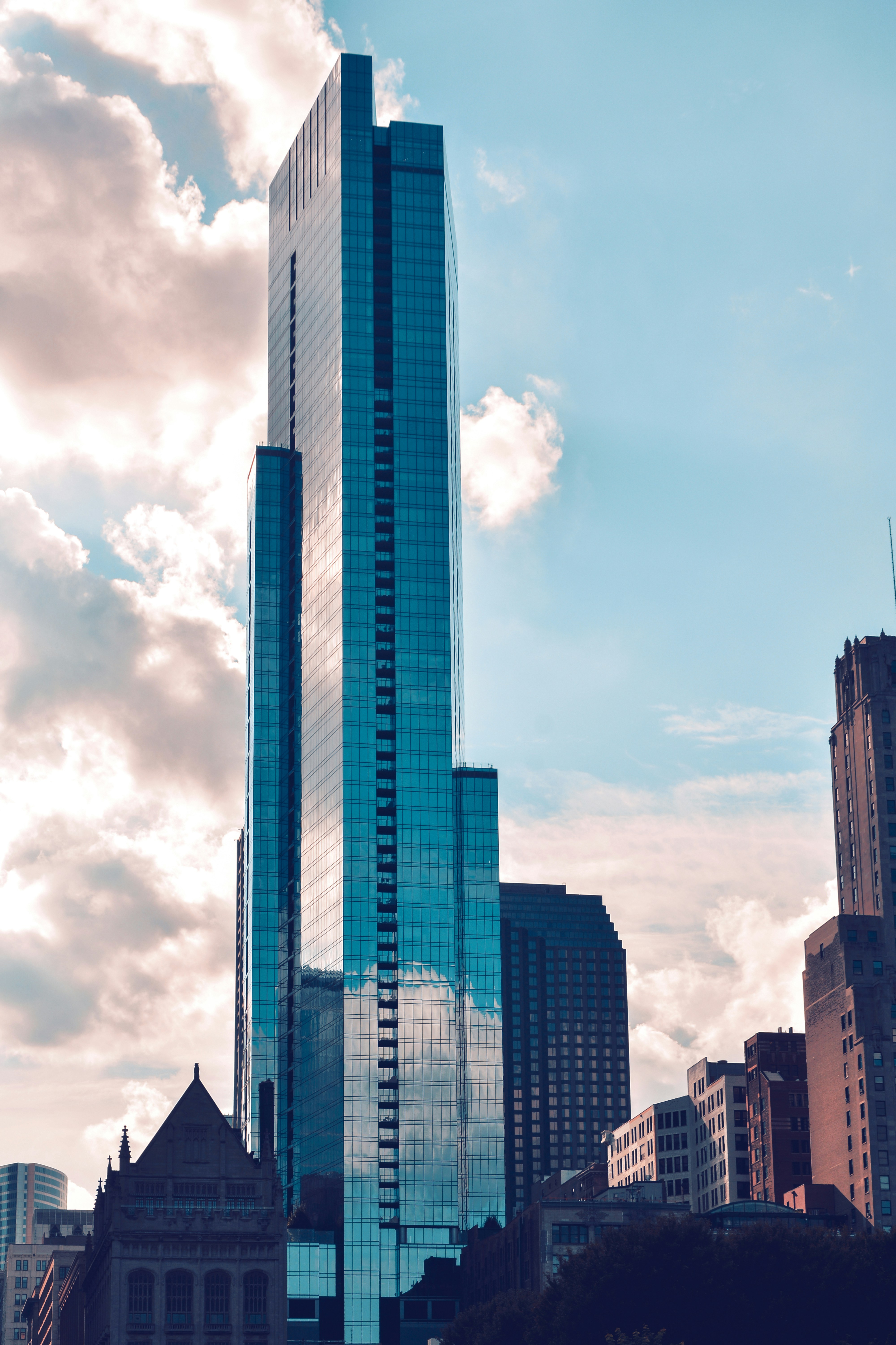 grey curtain building under white clouds