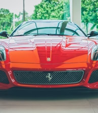 a red sports car parked in a showroom