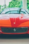 a red sports car parked in a showroom