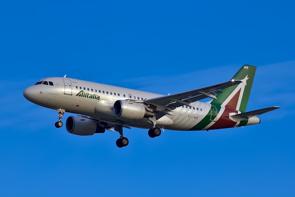 white and green plane during daytime