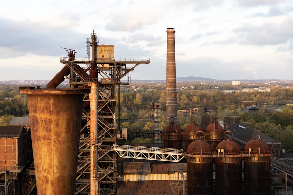 factory surrounded by trees during daytime