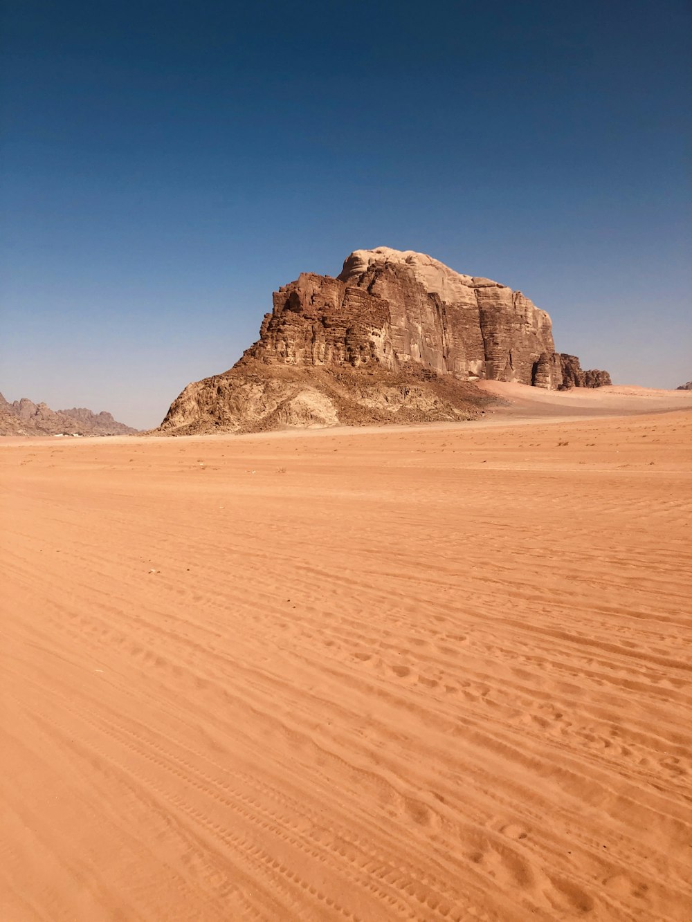 brown plateau under blue sky