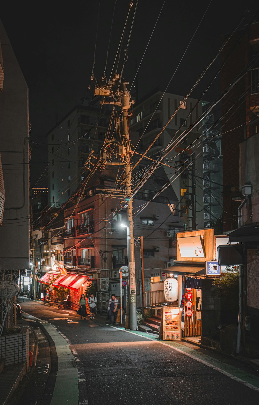 people standing beside street