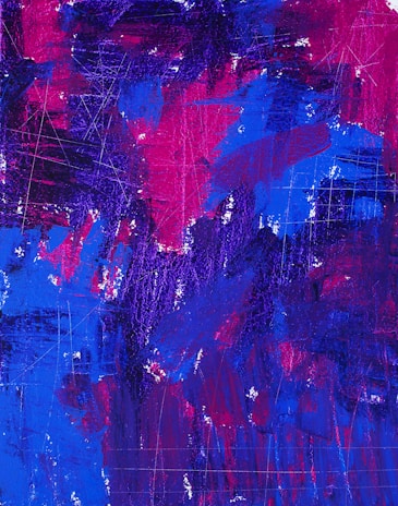 An abstract painting with a vibrant mix of blue, purple, and magenta colors, featuring various brush strokes and textured surfaces. There are visible scratch marks and areas of layered paint giving it a dynamic and energetic feel.
