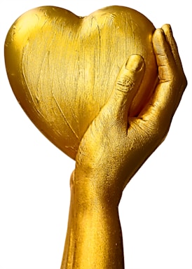 A golden hand holding a heart-shaped object, with a smooth, textured surface. The hand appears to be sculpted or painted gold, giving a sense of luxury and elegance.