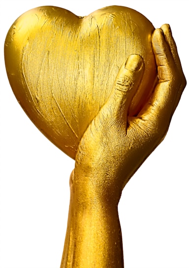 An elegant hand holding a gold note with a soft focus on the fine craftsmanship and metallic shine.