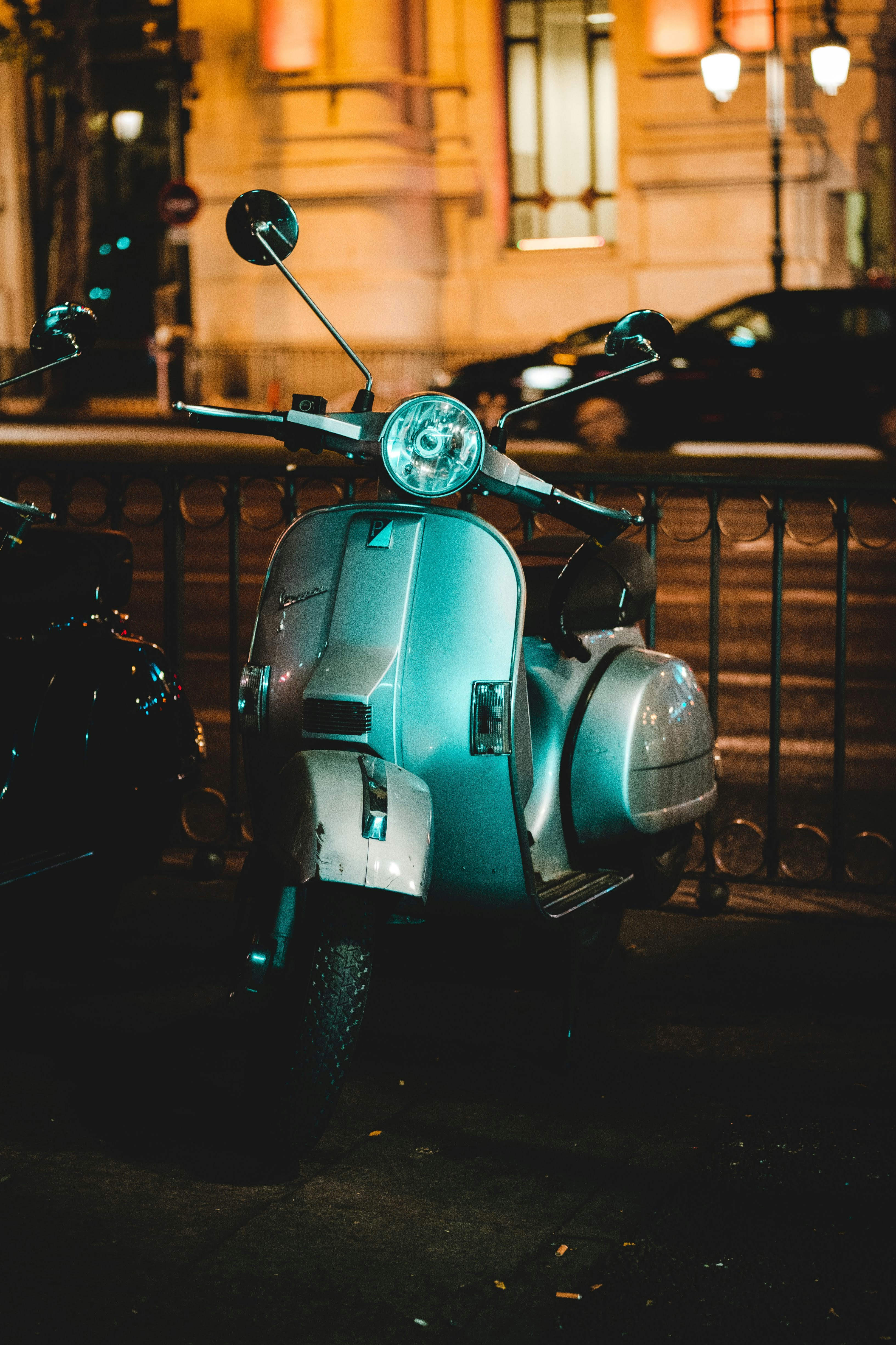 Silver Vespa at midnight in Madrid