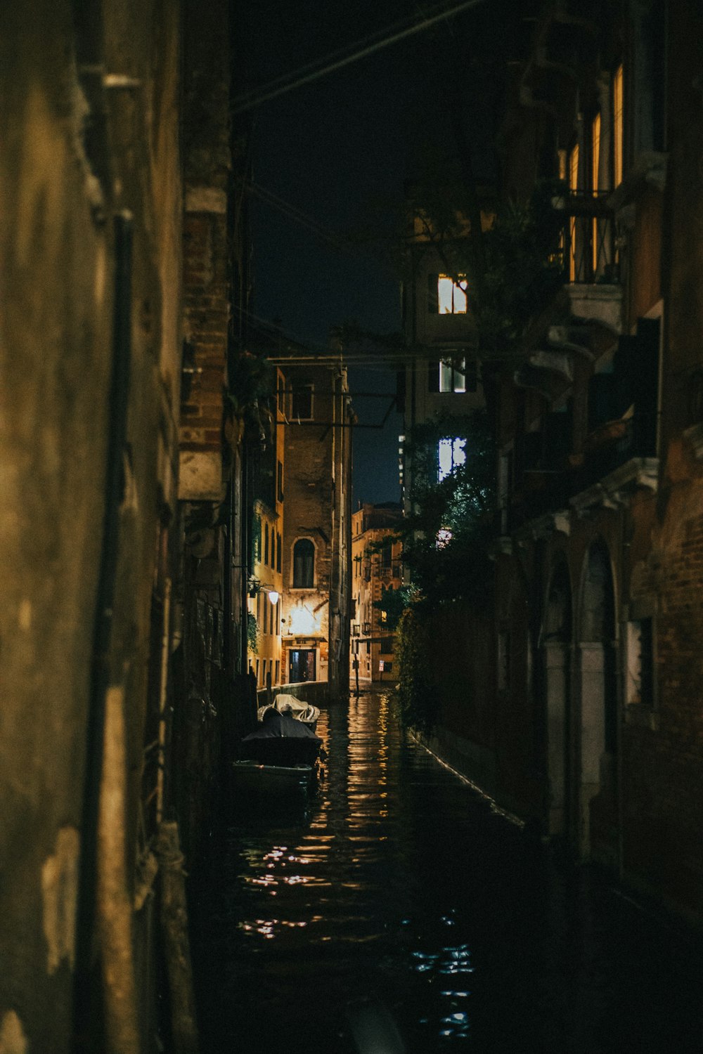 boat beside building at night