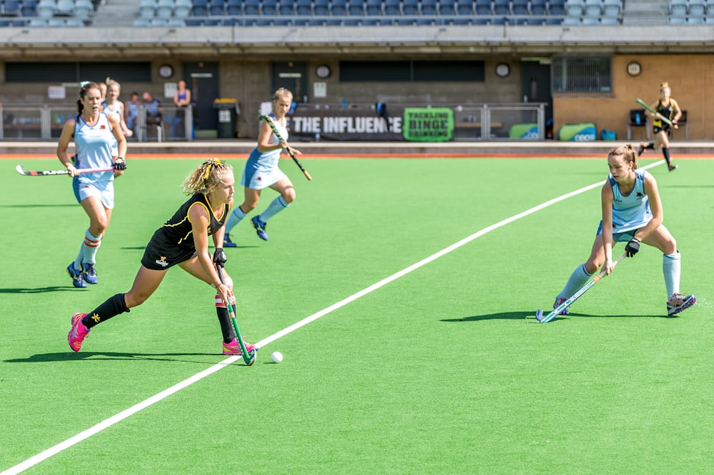 woman wearing black jersey playing on field