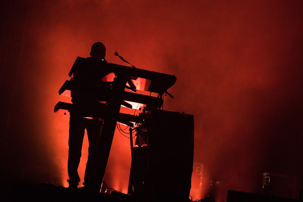 silhouette of man performing on stage
