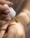 A close-up image of a dropper releasing a golden liquid onto the back of a person's hand. The person's skin appears smooth and is being delicately treated with the liquid, conveying a sense of care and attention.