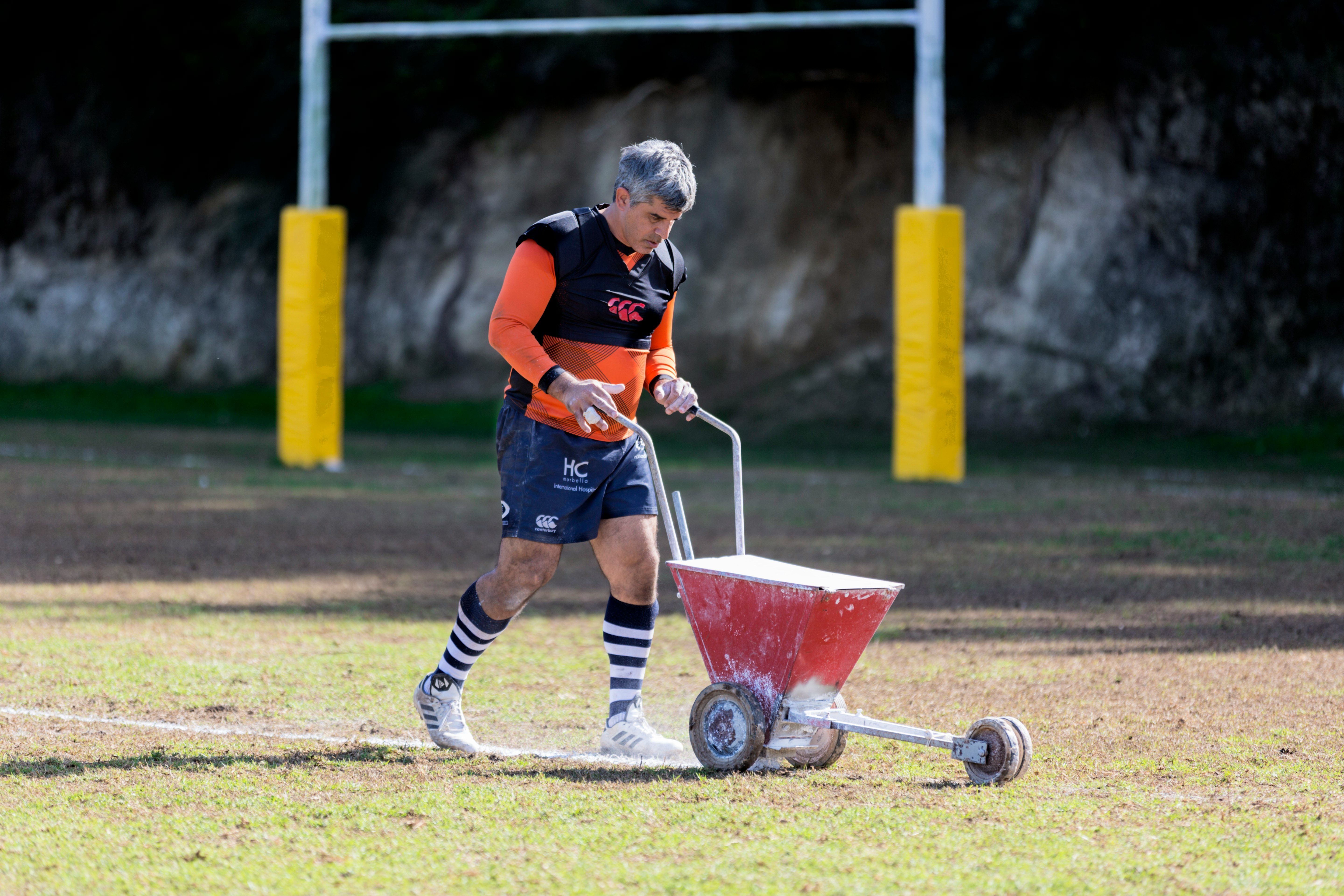 man painting the field