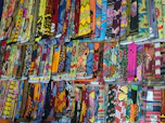 A vibrant display of Bhagalpuri silk sarees arranged beautifully, showcasing rich colors and intricate patterns.
