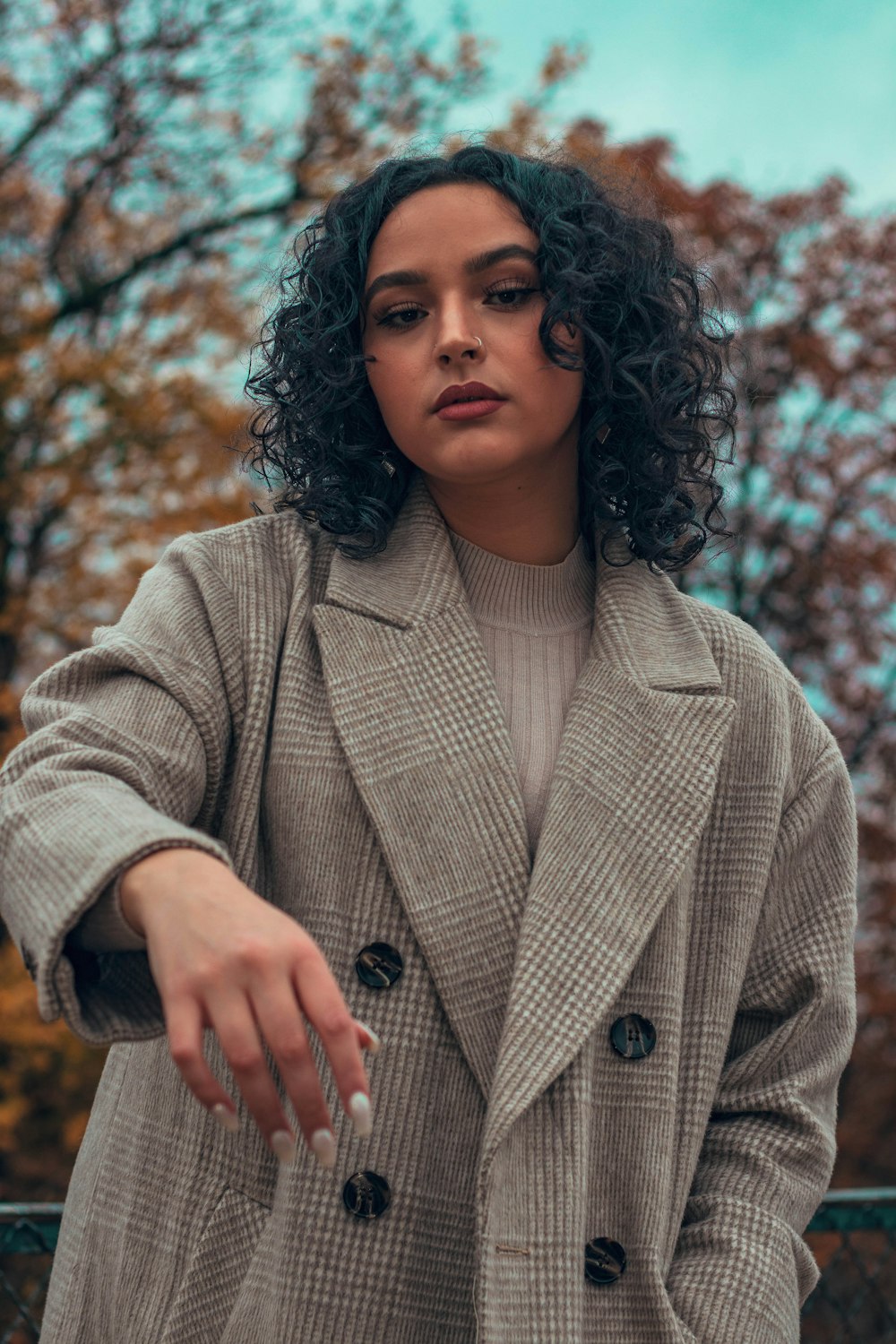 woman wearing gray trench coat