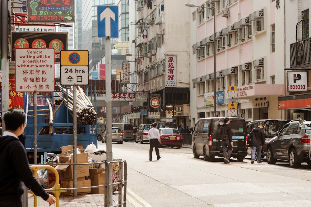 man walking on road during daytime