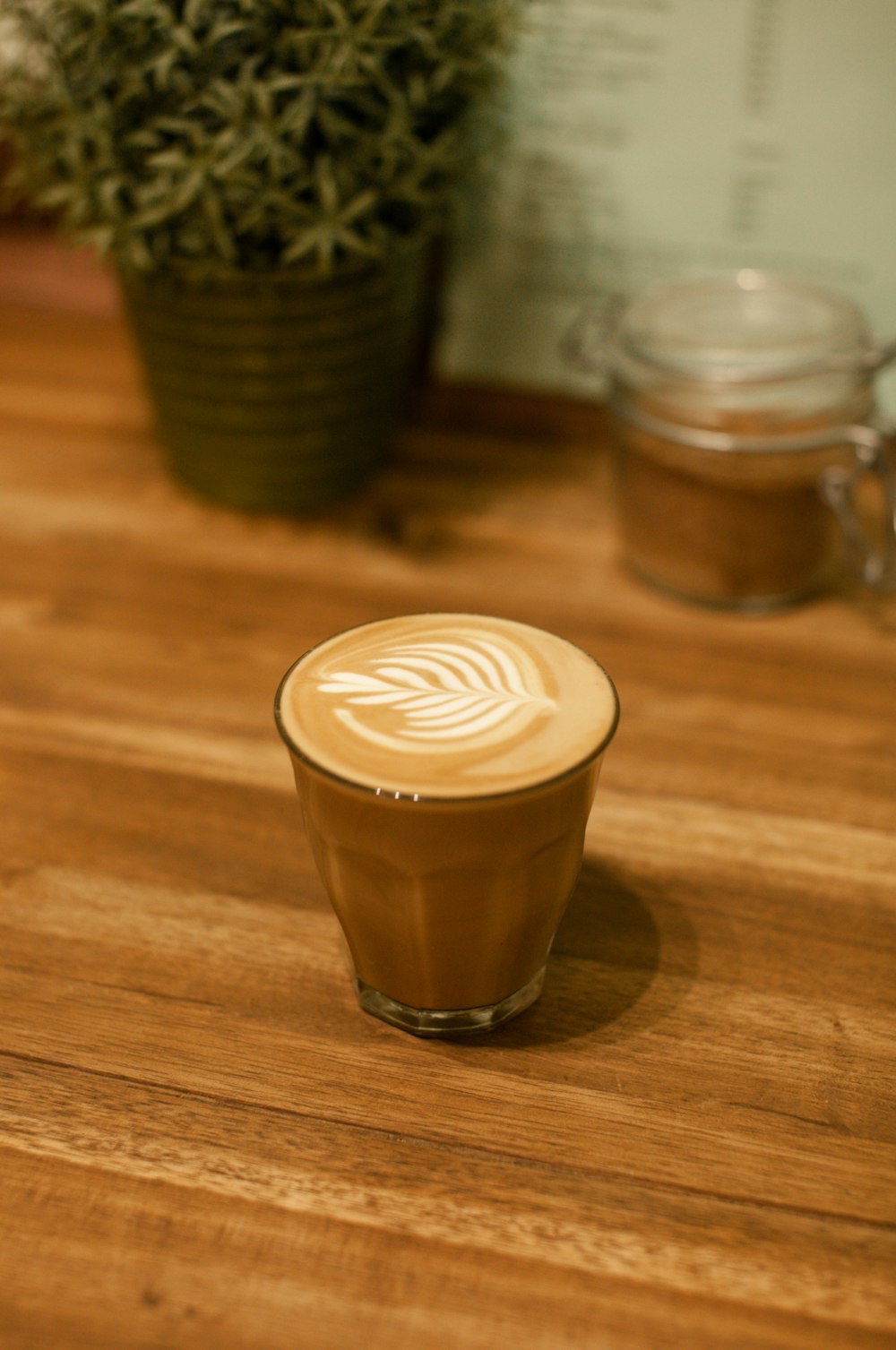 clear glass cup on wooden surface