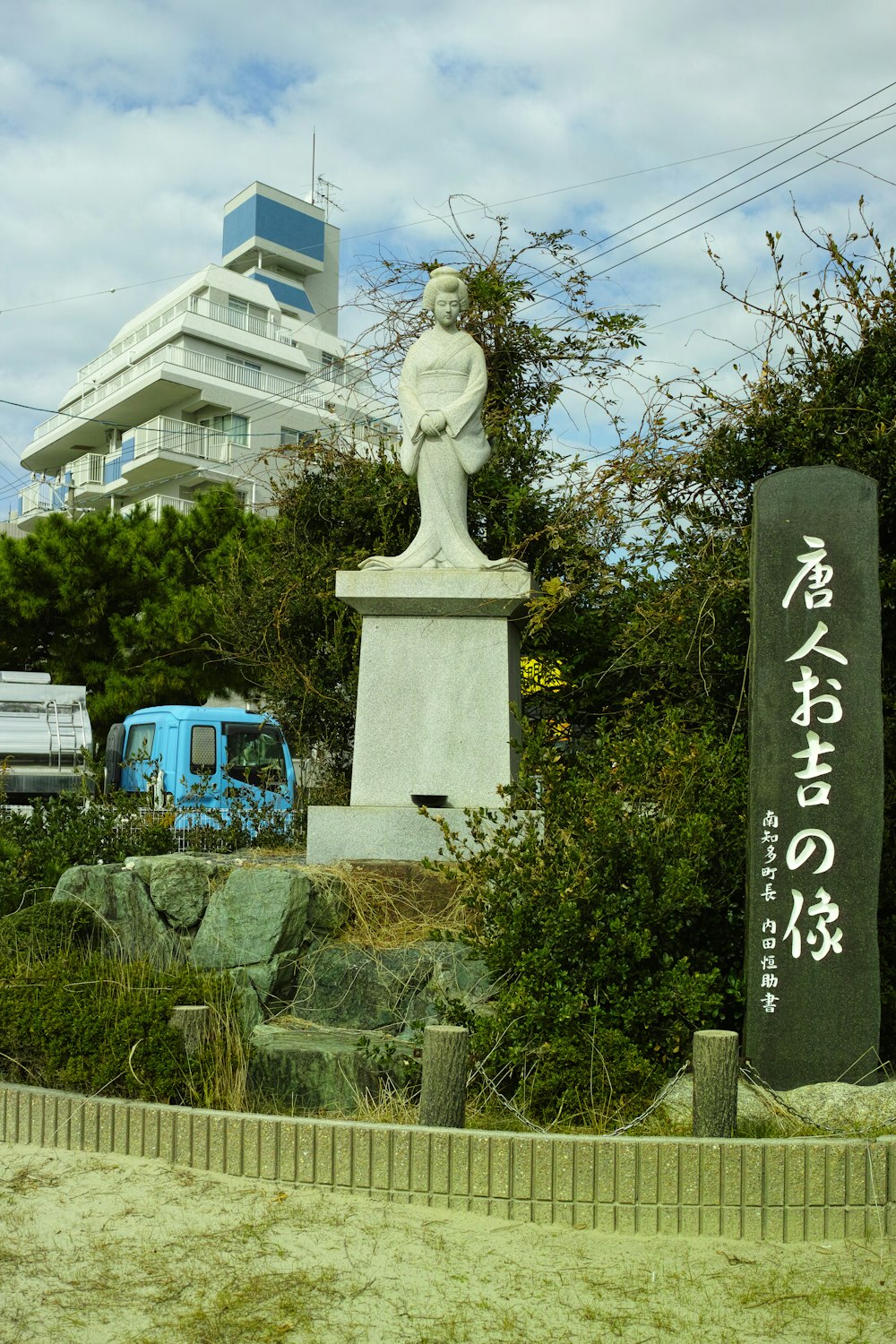 white concrete statue