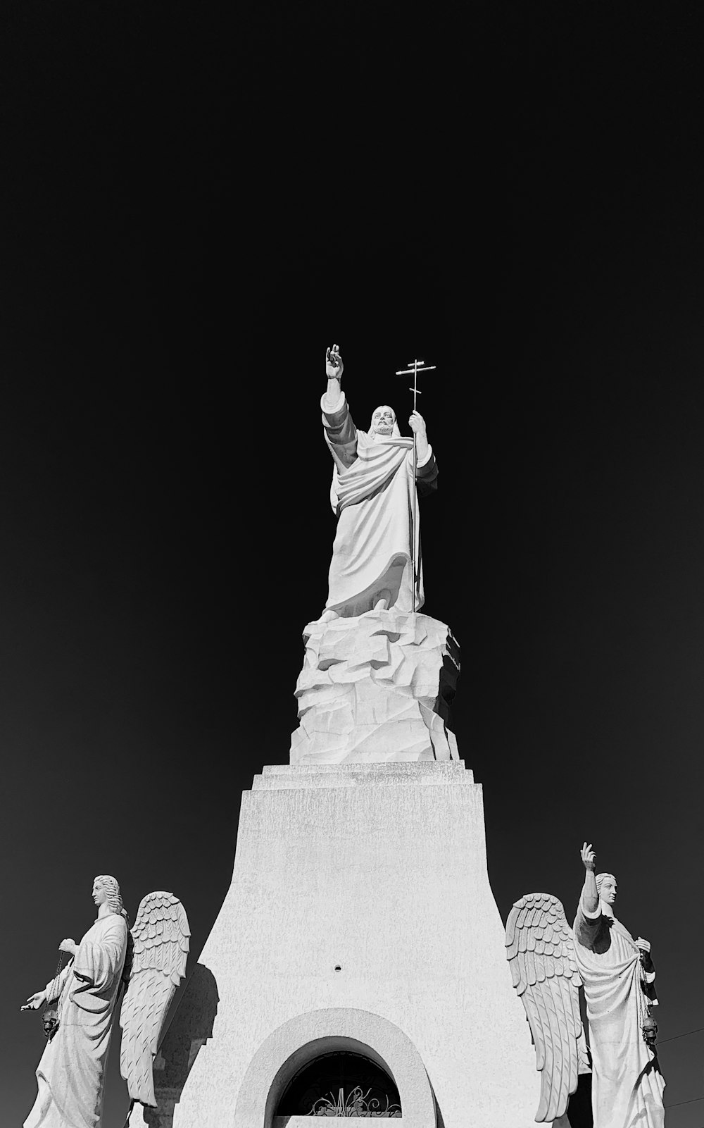 religious statue on grayscale photography