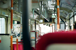 Interior view of a spacious, clean bus with plush seats and large windows.