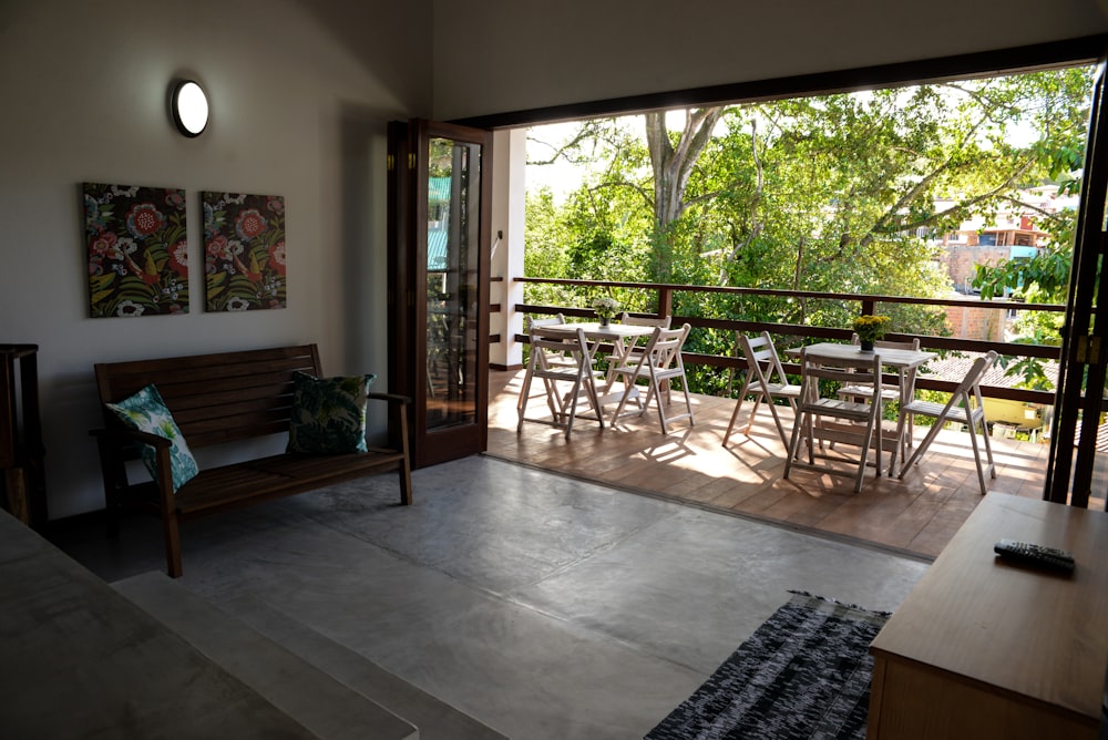 brown wooden dining table on balcony