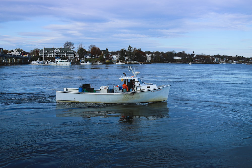 a small boat floating on top of a body of water