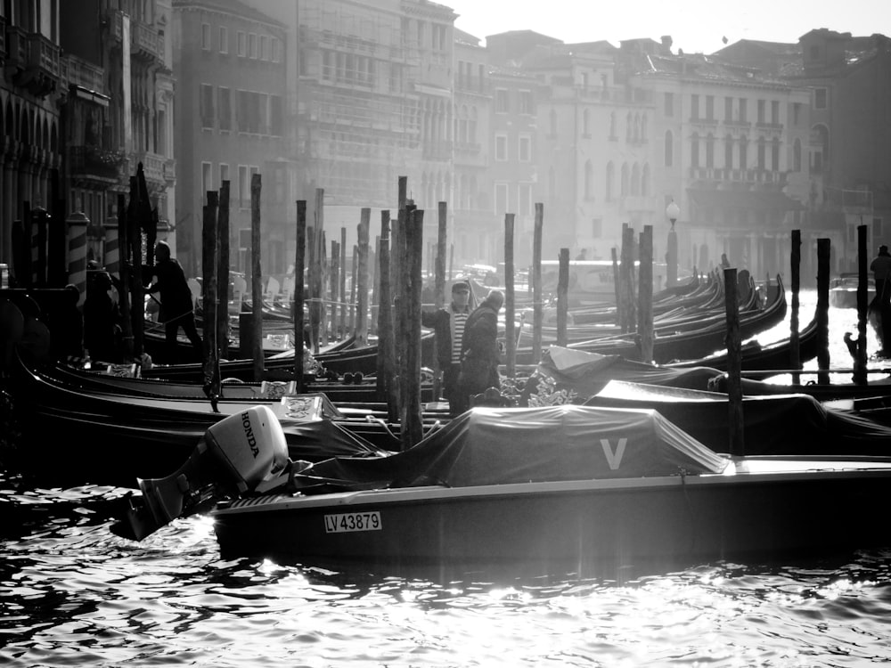 a black and white photo of a row of gondolas