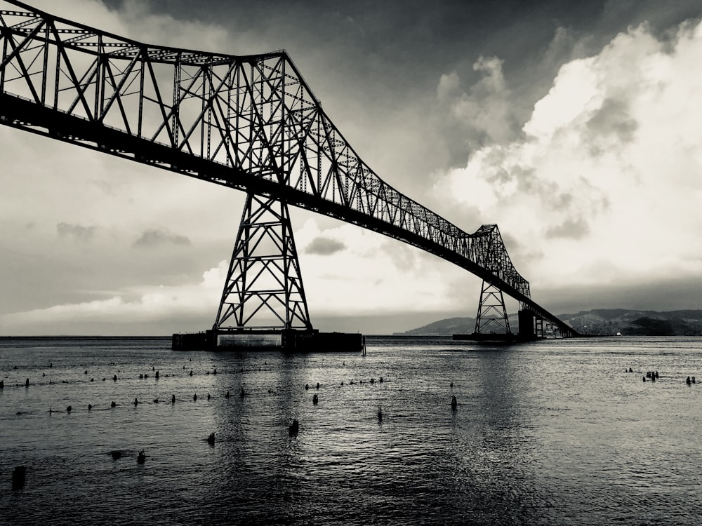 metal bridge above water during day