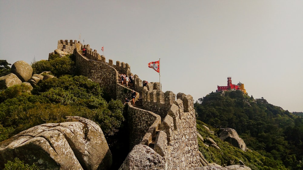 view photography of stone castle and wall during daytime