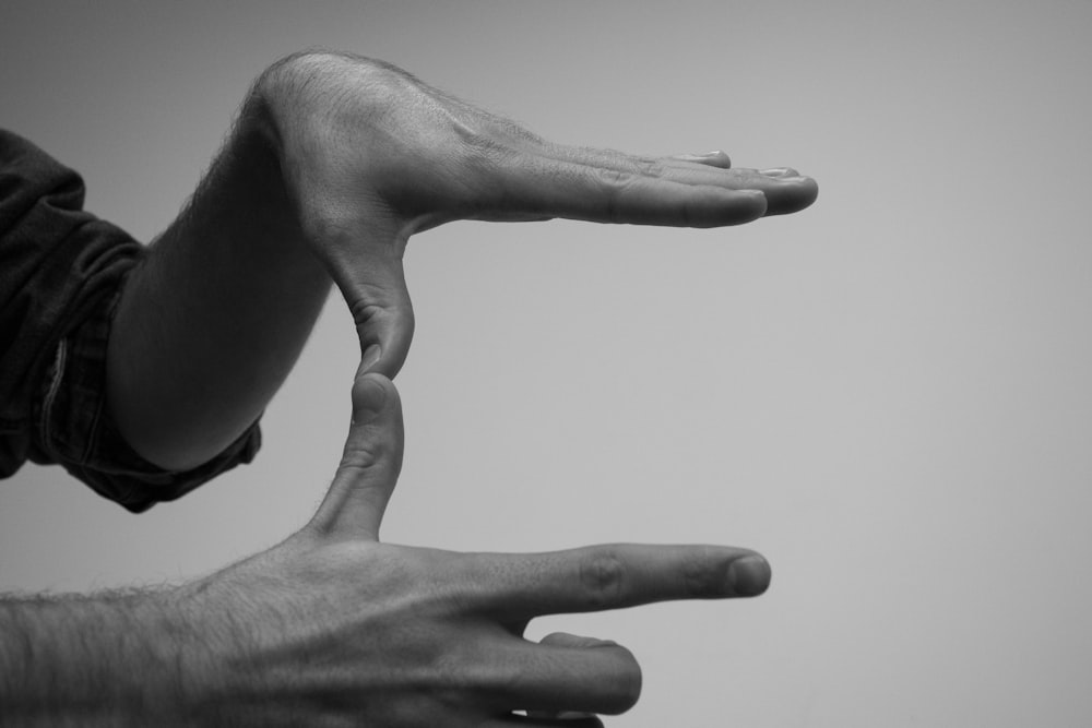 human hands forming a U