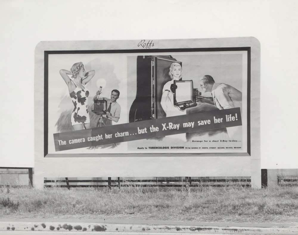 billboard beside grass field