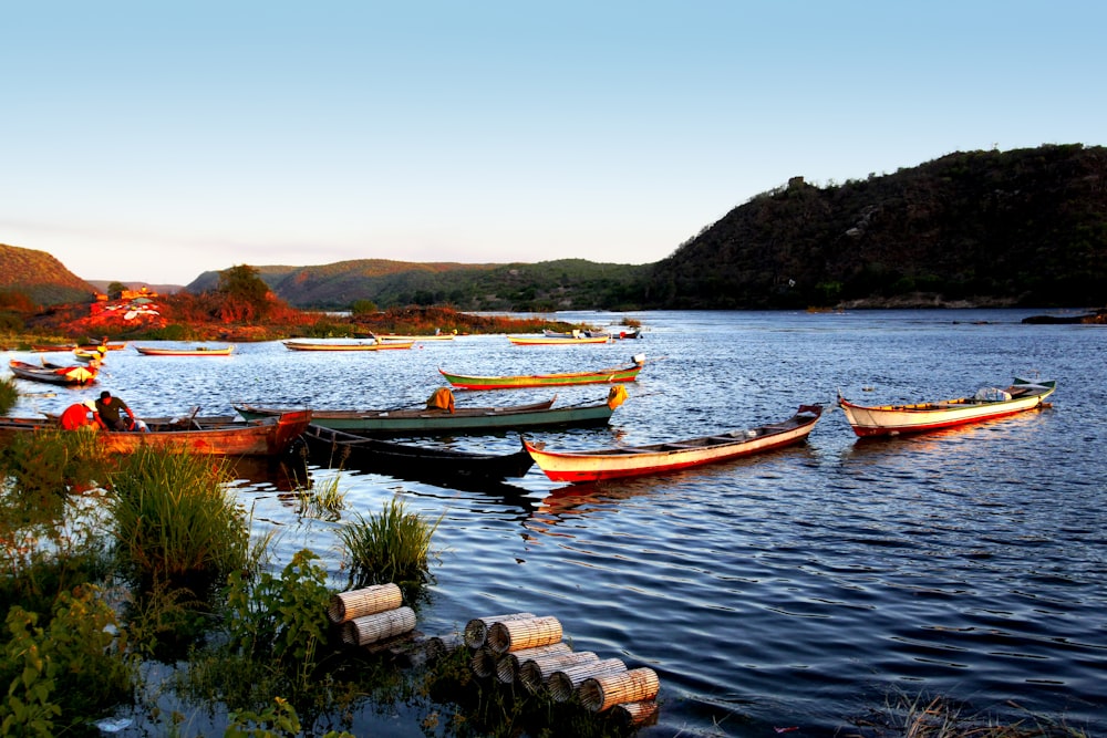 two white-and-red boats on body of water