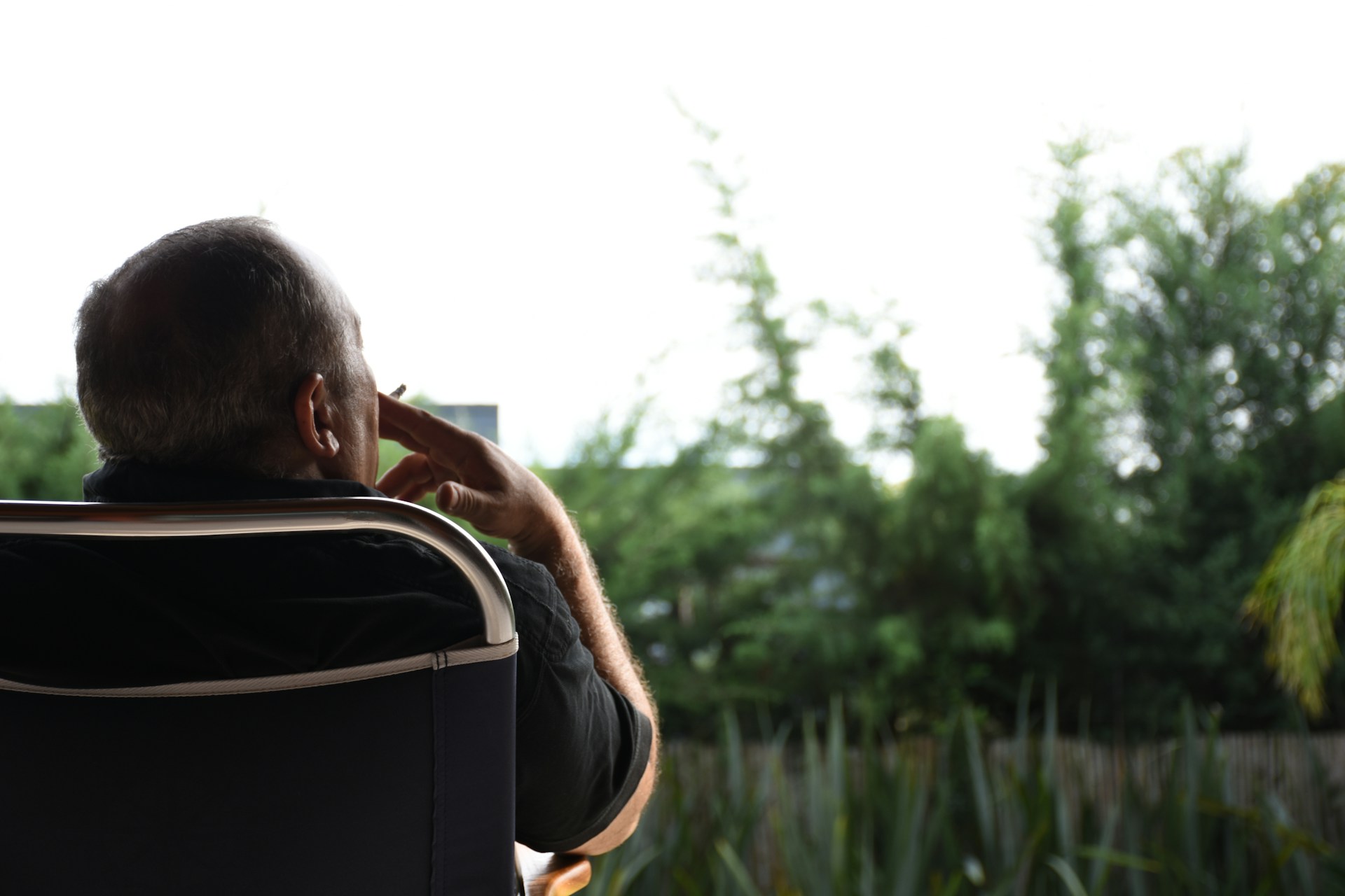 woman wearing yellow long-sleeved dress under white clouds and blue sky during daytime