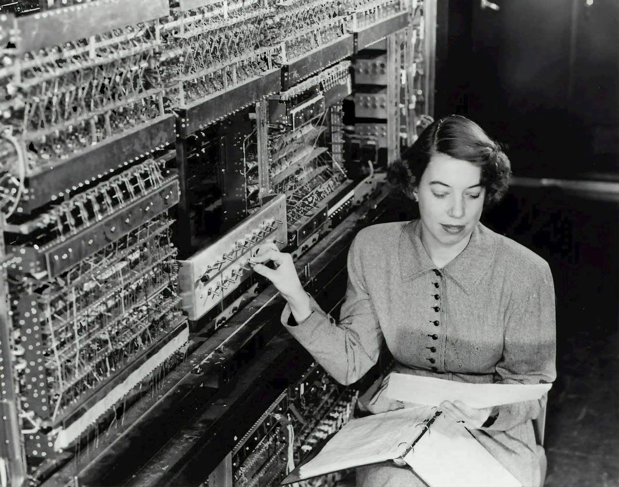 old computers, women sitting on a chair