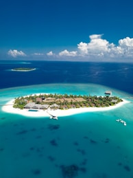 islet under blue sky
