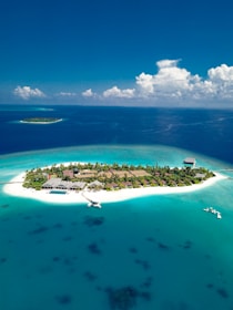islet under blue sky