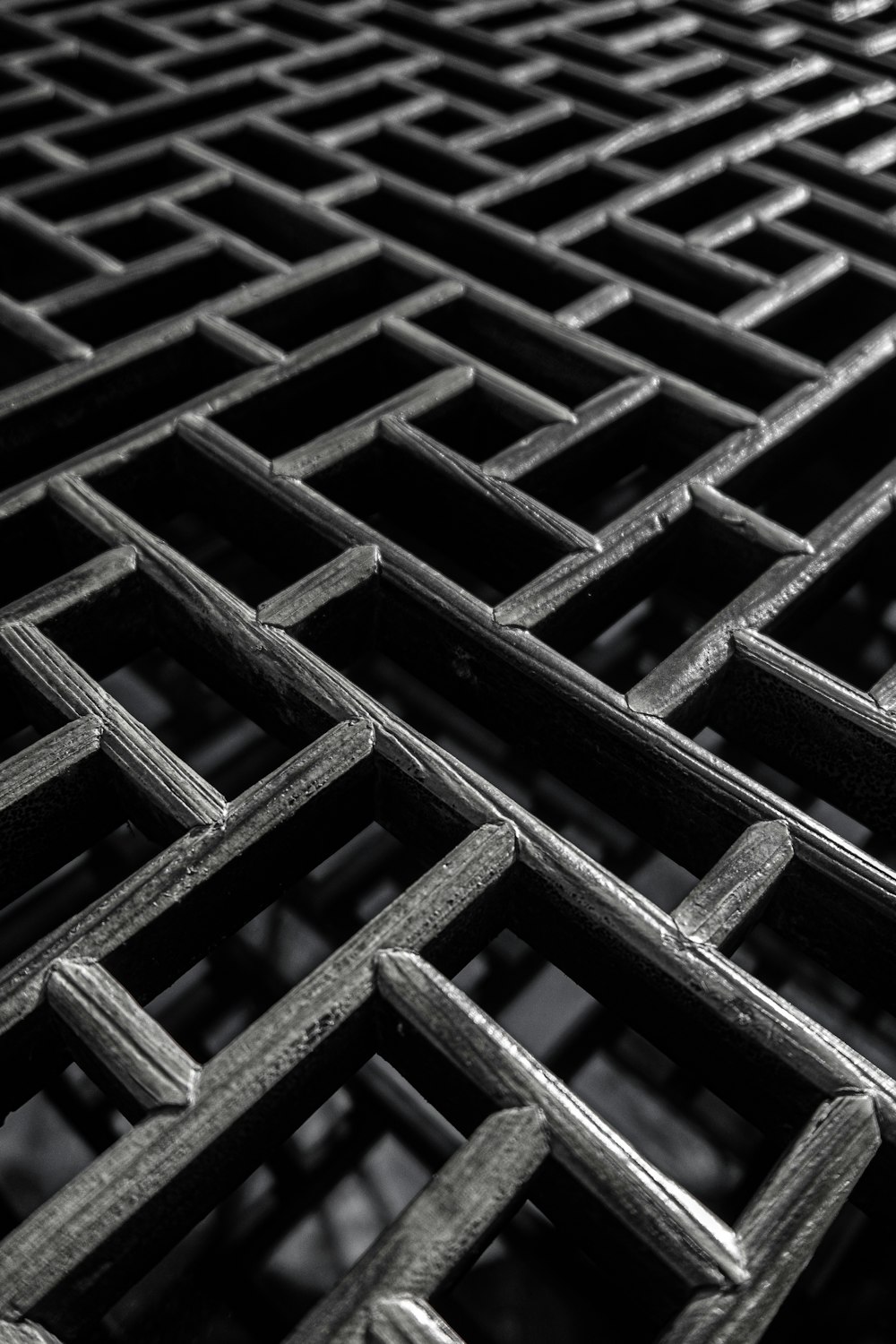 a black and white photo of a metal grate