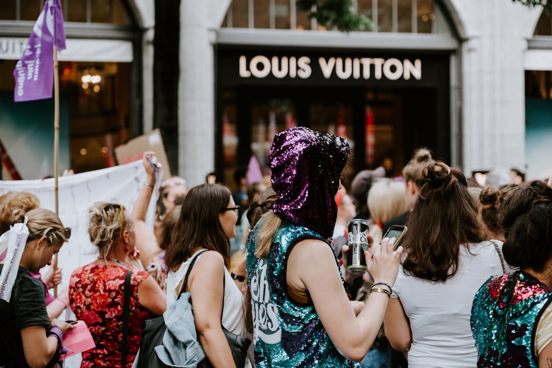 people near Louis Vuitton shopfront